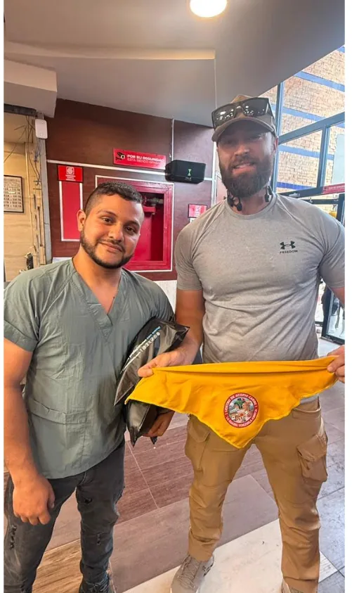 Handover of donated medical supplies with a local responder